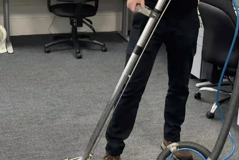 Premier cleaner using a carpet extraction machine in an office