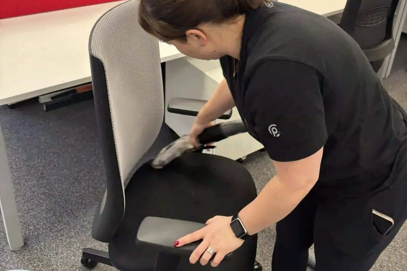 Premier cleaner cleaning an office chair