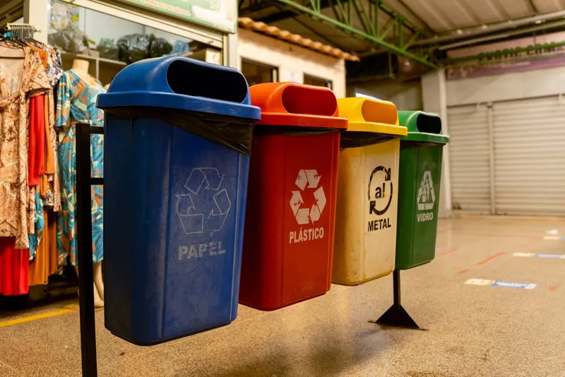 Colour-coded recycling bins for paper, plastic, metal and glass