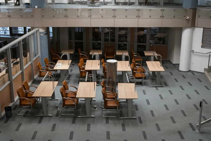 Staff canteen with rows of tables and chairs