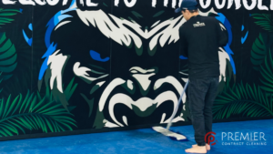 Professional gym deep cleaning team disinfecting gym equipment, mats, benches and changing room surfaces to help prevent skin infections in a Dublin fitness centre.