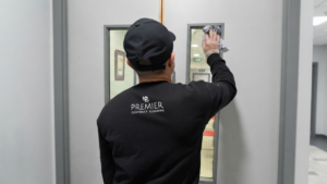 Professional cleaners disinfecting desks, keyboards and office touchpoints during a norovirus outbreak deep clean in a Dublin office.